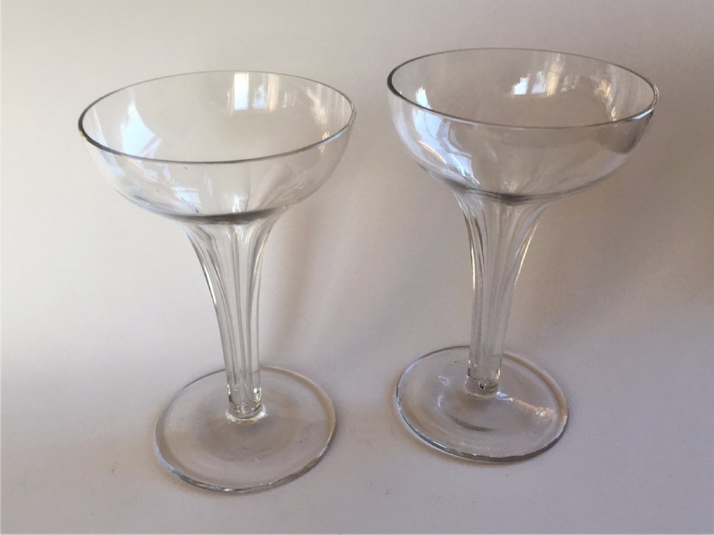 A charming pair of hollow stem champagne glasses View II