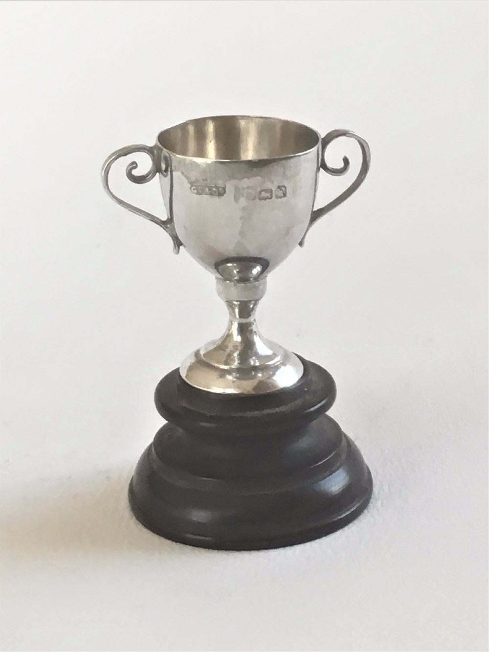 A charming miniature Edwardian silver trophy cup