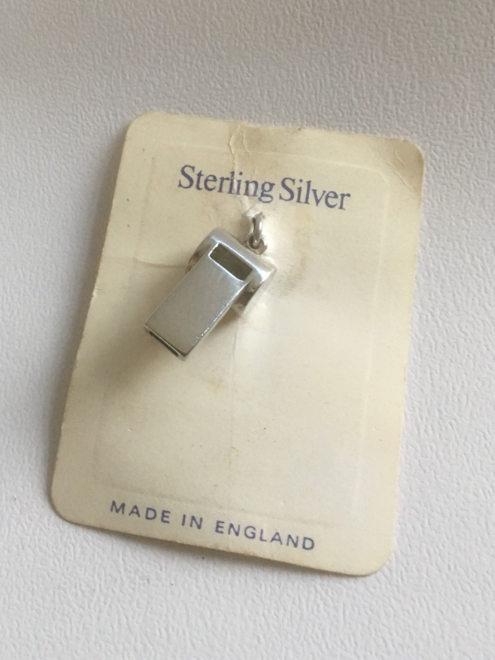 A miniature Sterling silver dog whistle