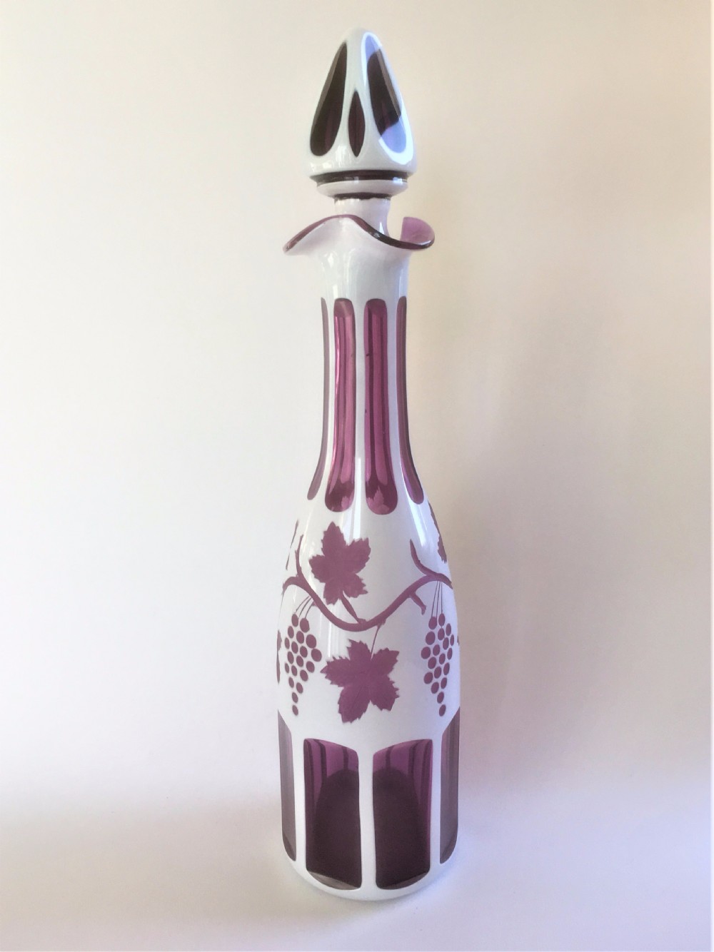 A fabulous Bohemian amethyst and white overlay decanter