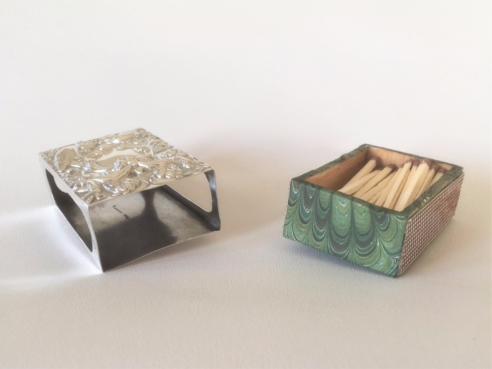 A superb William Comyns silver table match box View VII