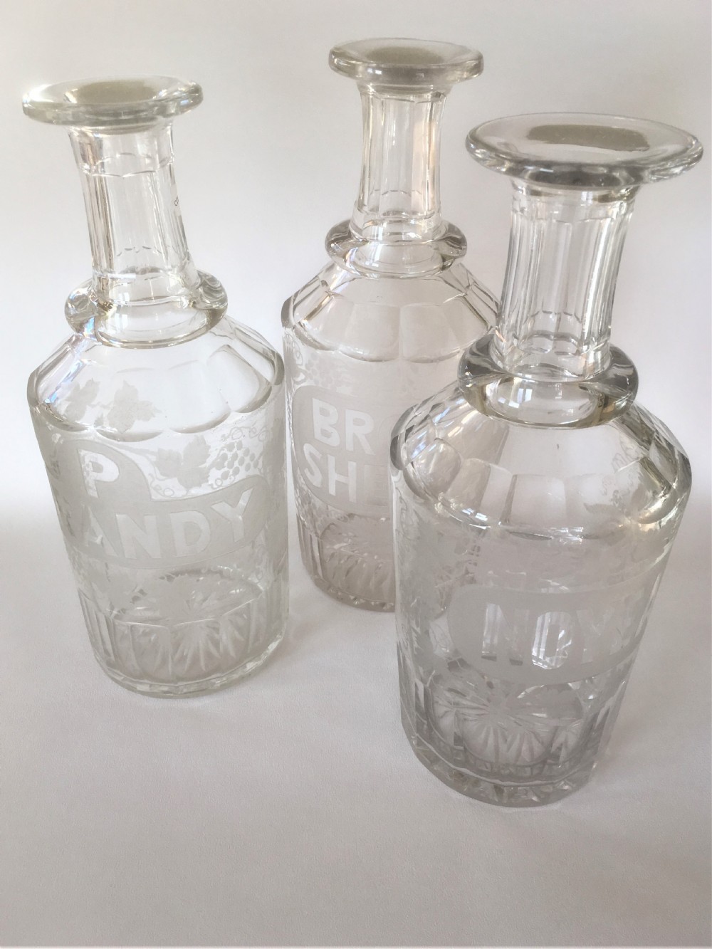 A set of three very rare Victorian bar bottles