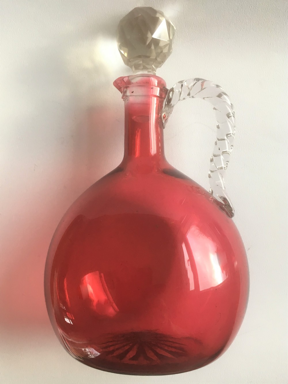 A Victorian cranberry wine jug with barley twist handle View II