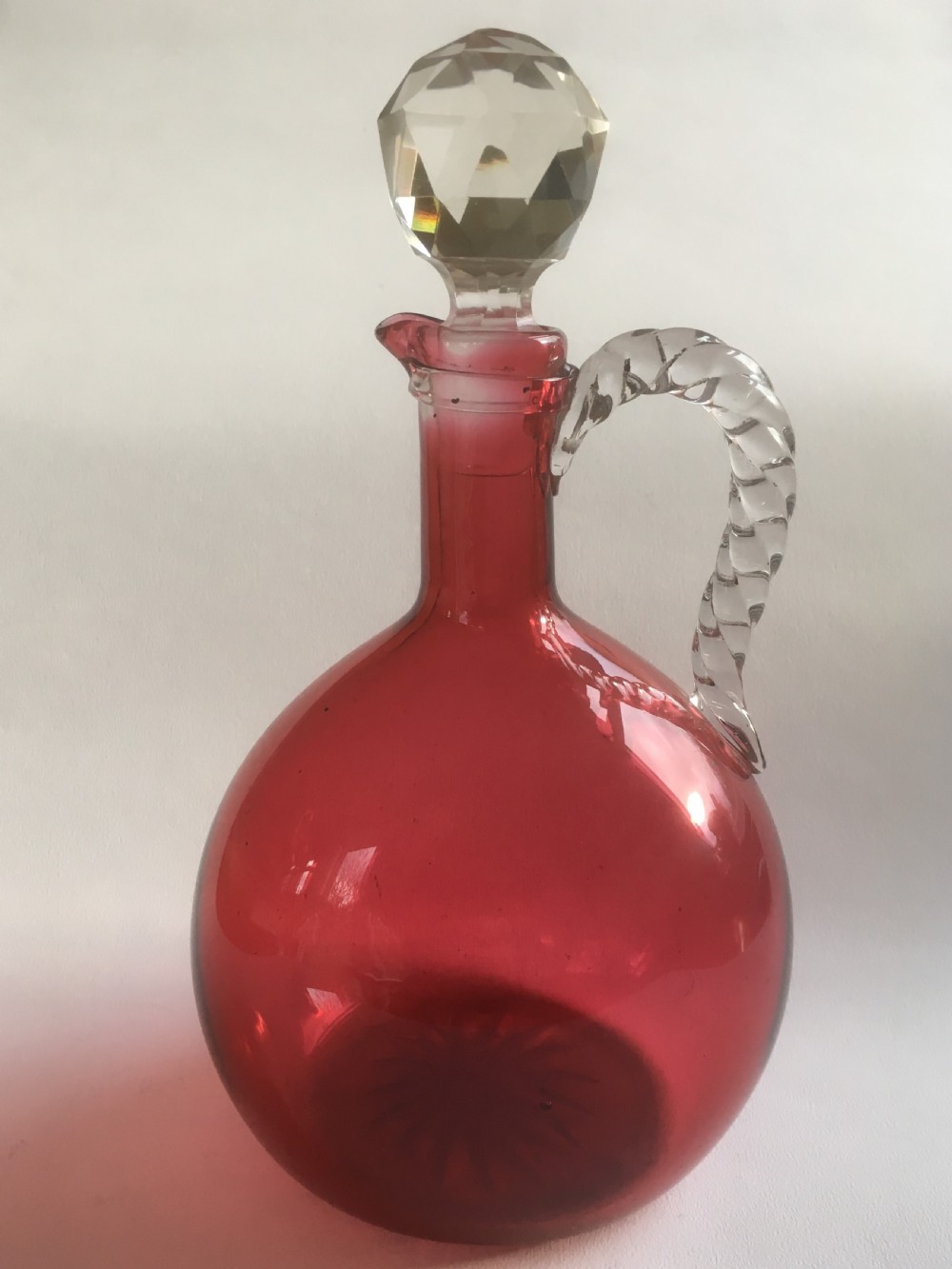 A Victorian cranberry wine jug with barley twist handle View III