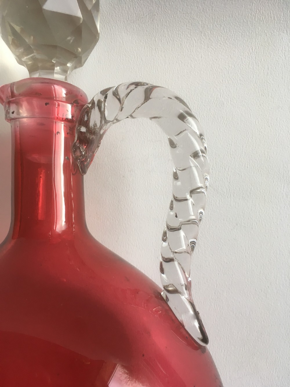 A Victorian cranberry wine jug with barley twist handle View IV