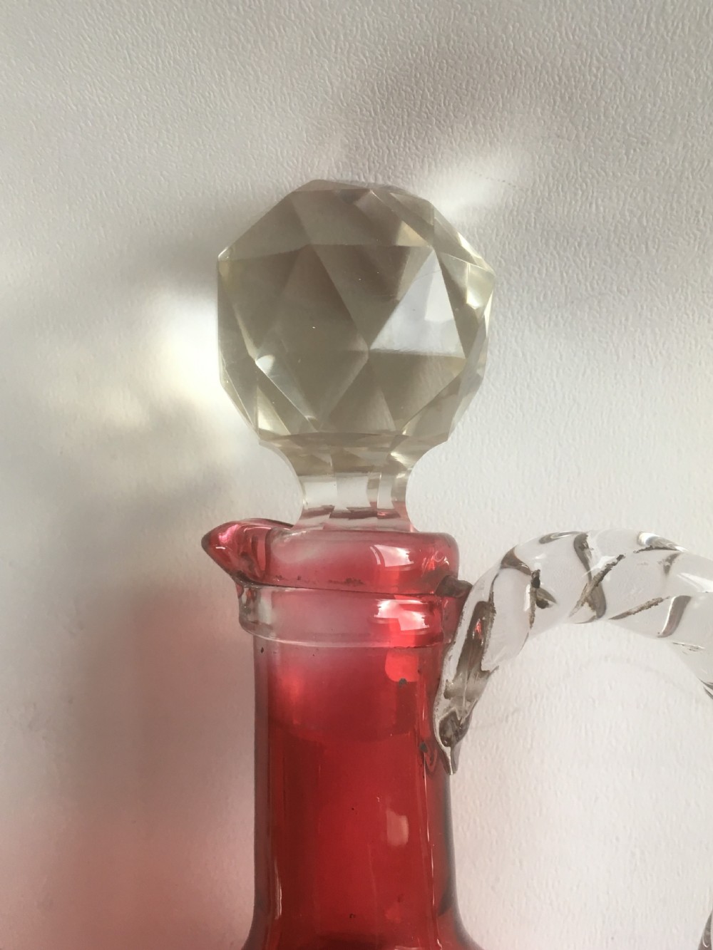 A Victorian cranberry wine jug with barley twist handle View VI