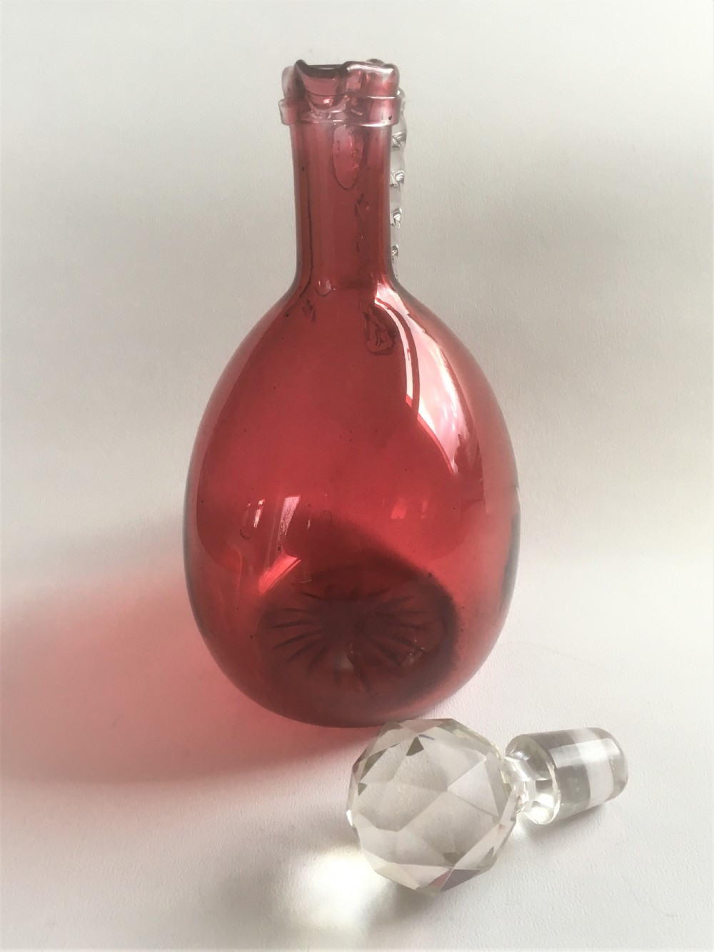A Victorian cranberry wine jug with barley twist handle View VII