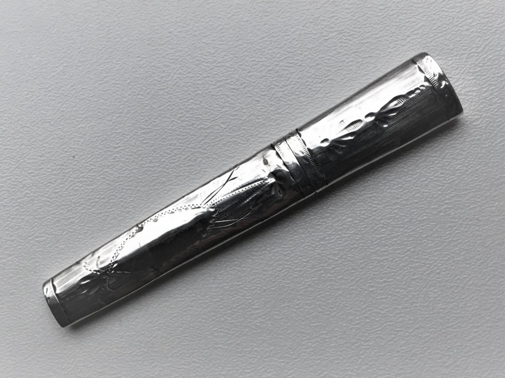A Georgian bright cut silver needle case