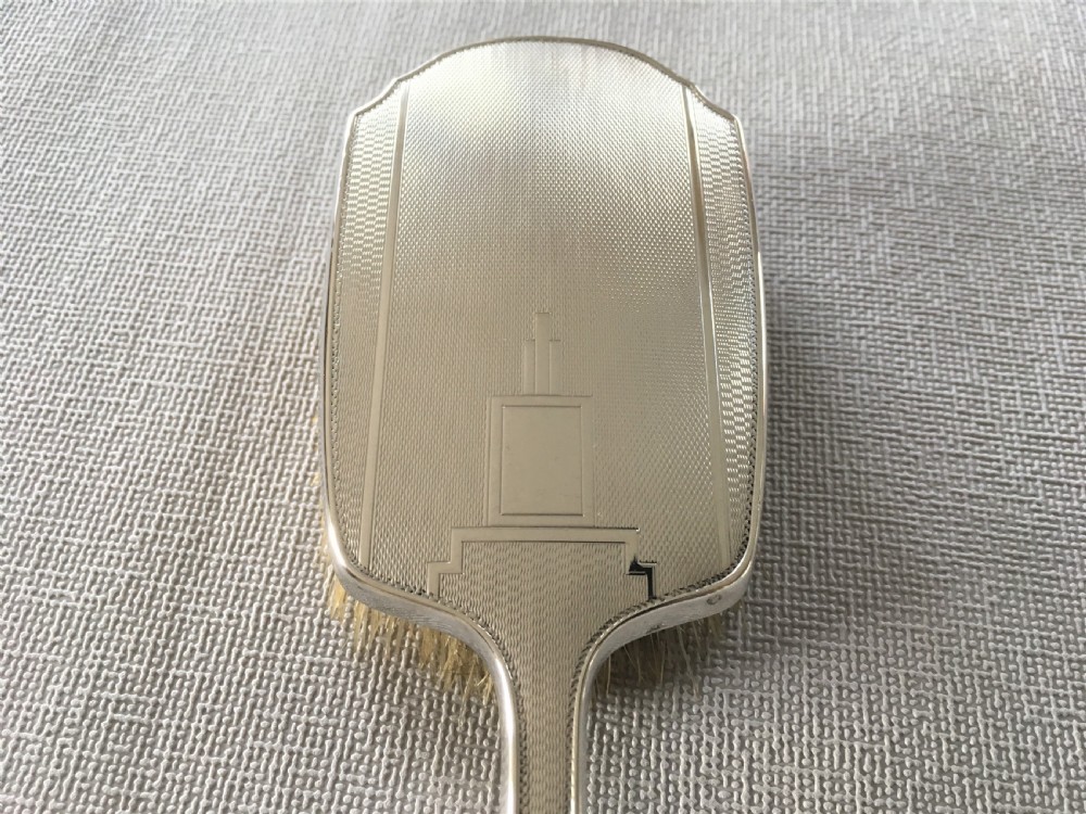 A set of four Art Deco silver brushes View V