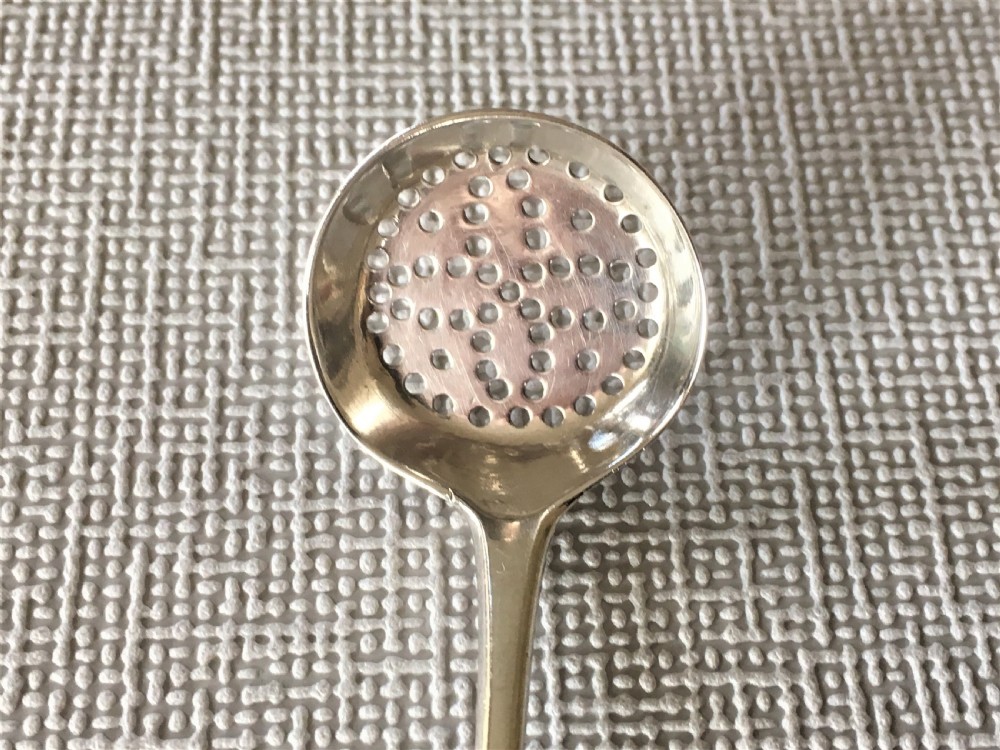 A rare 18th Century silver spice sifting spoon View II