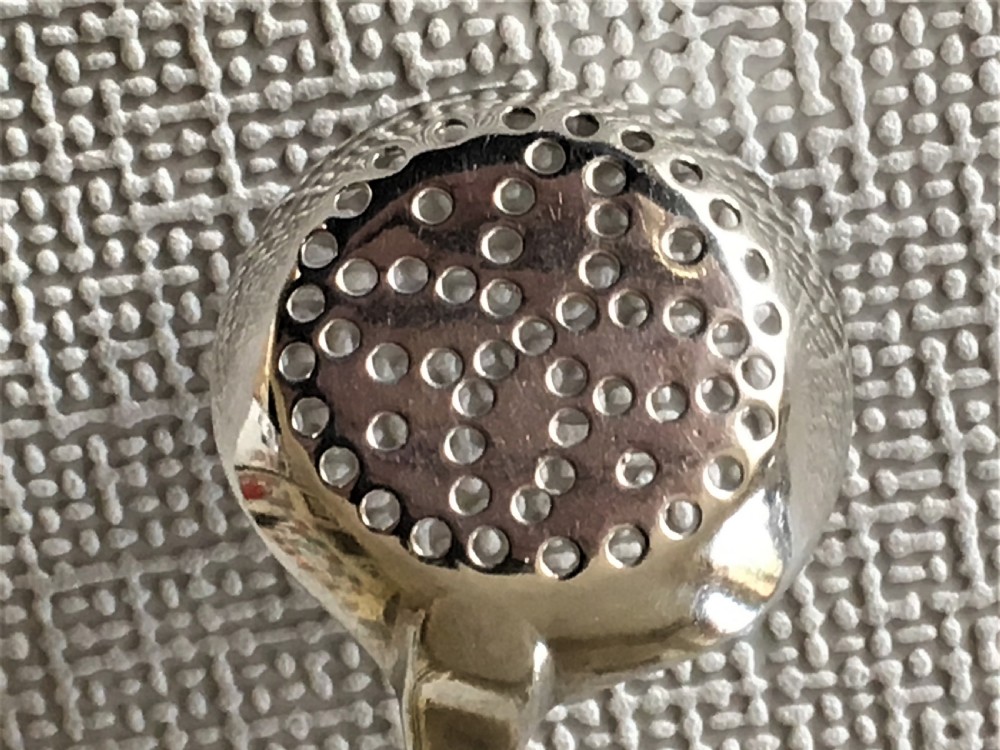 A rare 18th Century silver spice sifting spoon View V