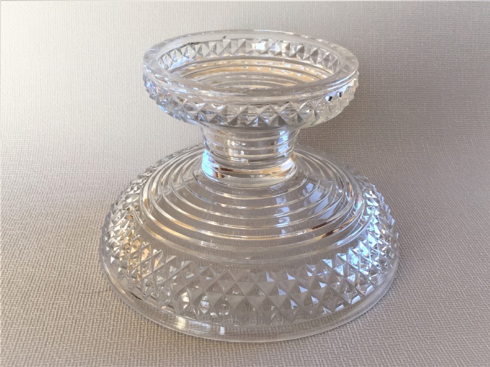 A small Regency cut glass pineapple stand