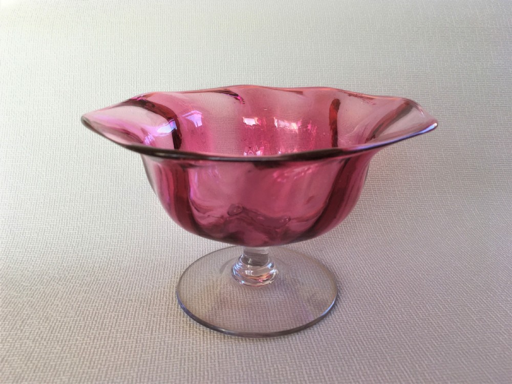 A Victorian cranberry wrythen pedestal bowl View III