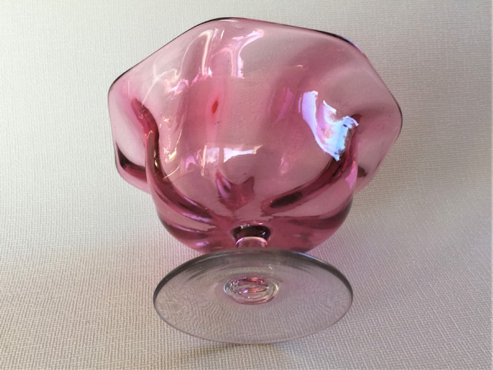 A Victorian cranberry wrythen pedestal bowl View VI