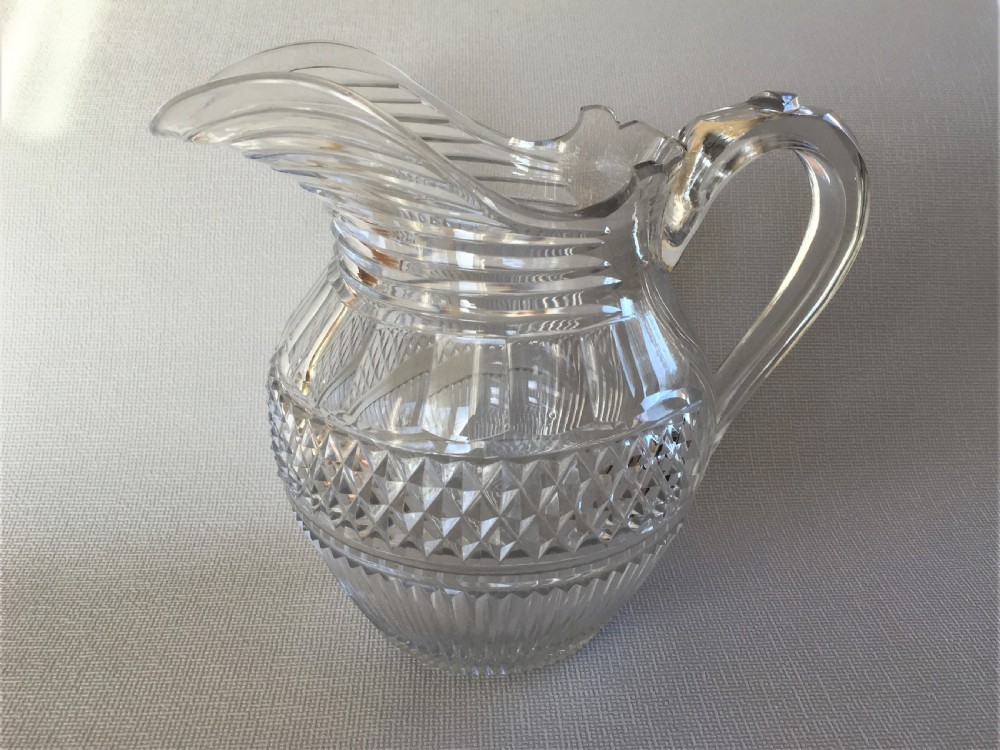 A handsome Regency cut glass water jug