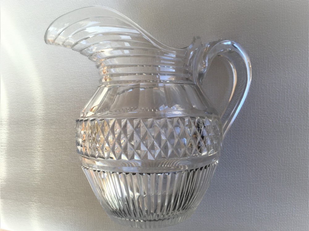 A handsome Regency cut glass water jug View X