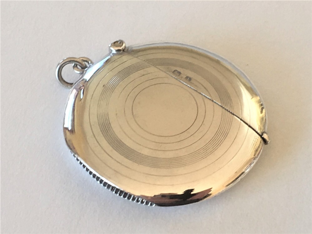 A rare Edwardian circular silver vesta