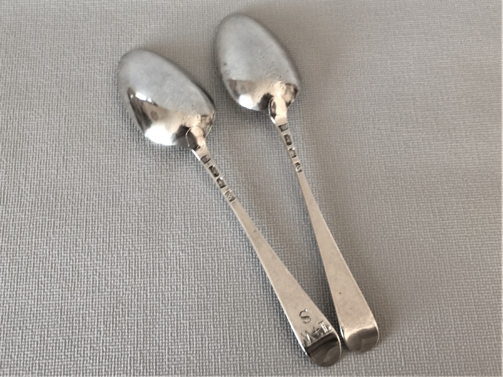 A superb pair of 18th Century silver fancy back spoons