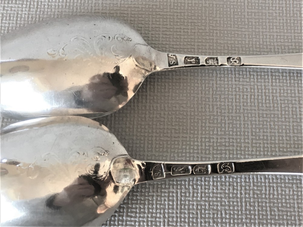 A superb pair of 18th Century silver fancy back spoons View II