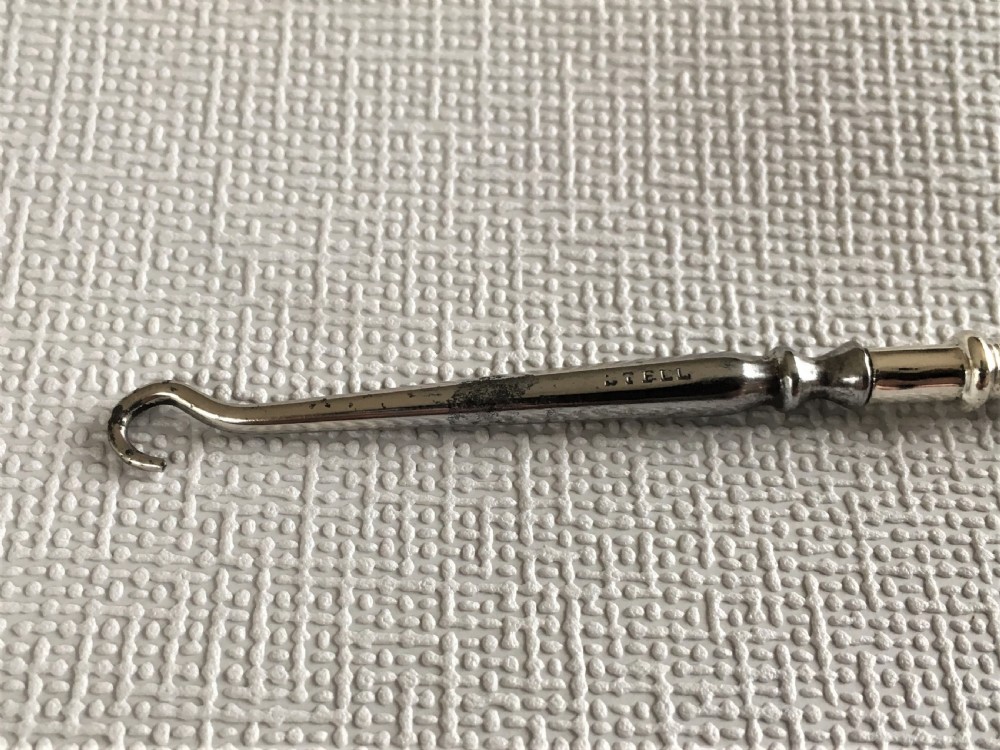 A rare silver golf club button hook View II