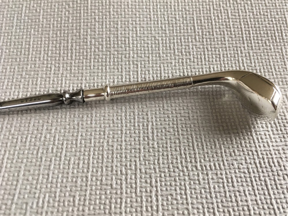 A rare silver golf club button hook View III