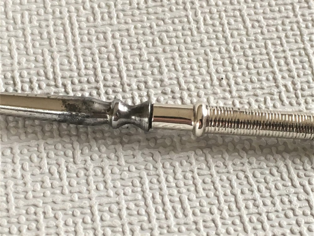 A rare silver golf club button hook View VI