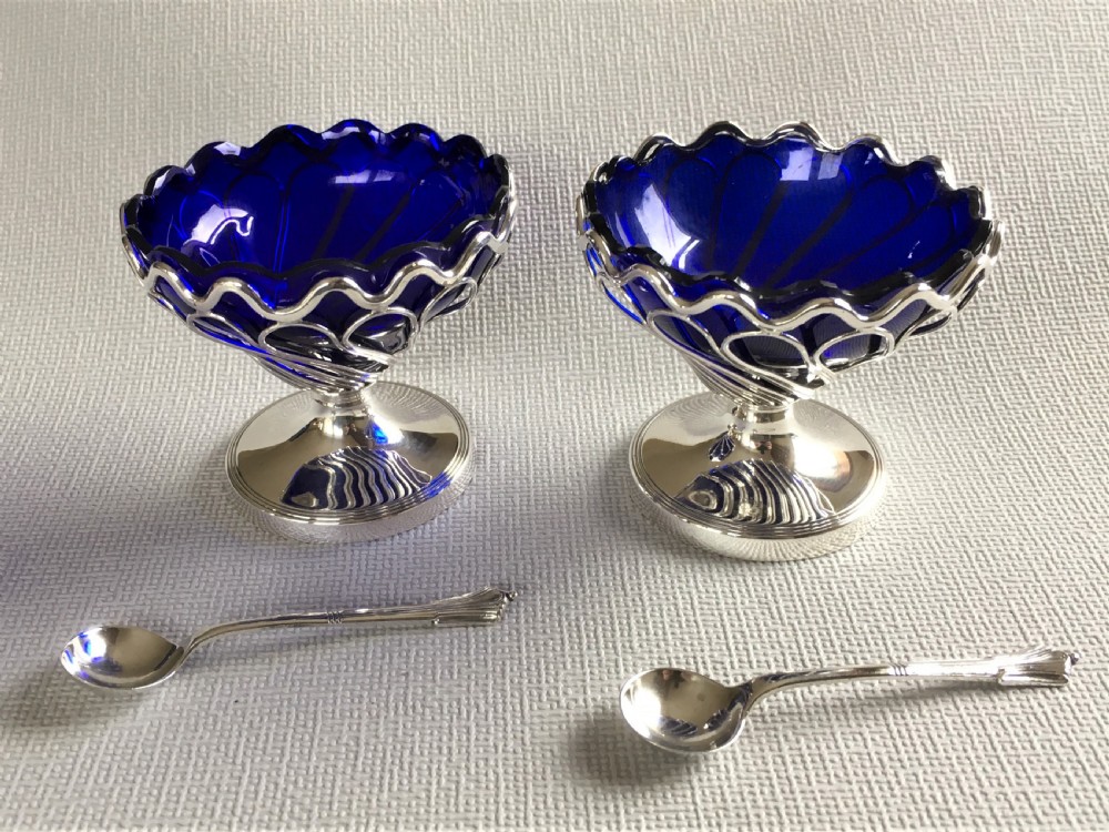 A superb boxed pair of silver condiment tubs & spoons View VII