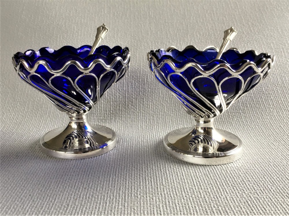 A superb boxed pair of silver condiment tubs & spoons View V