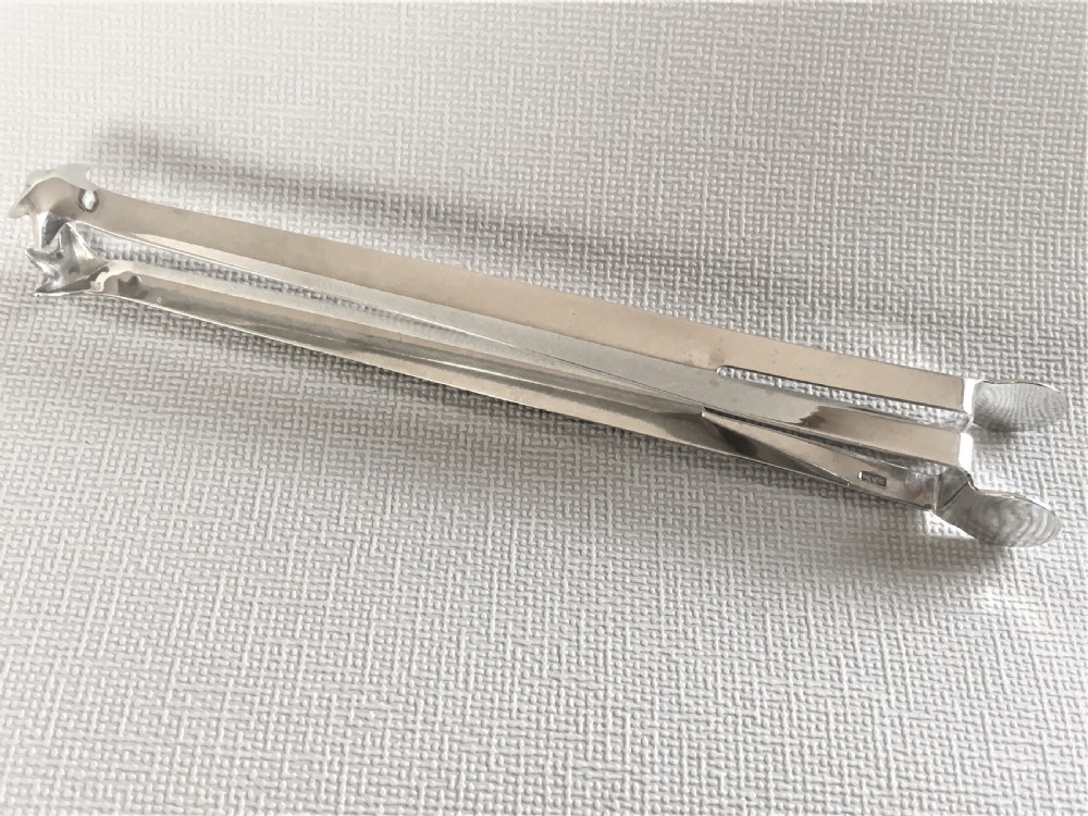 A pair of patented Edwardian silver ice tongs