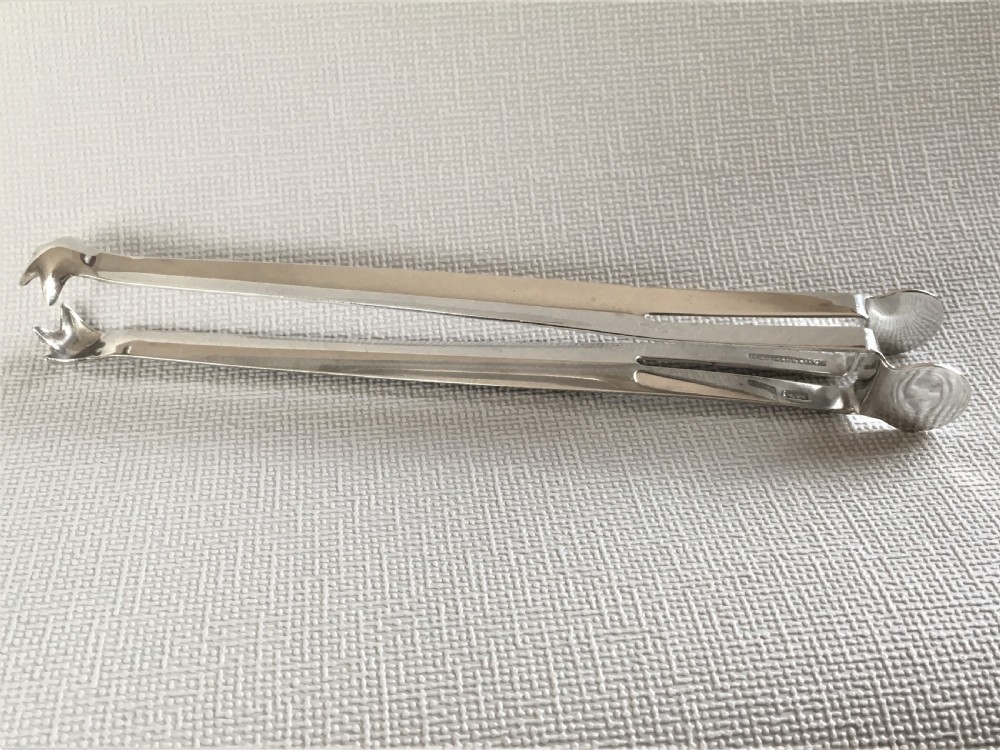 A pair of patented Edwardian silver ice tongs View II