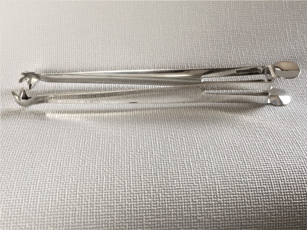 A pair of patented Edwardian silver ice tongs View III