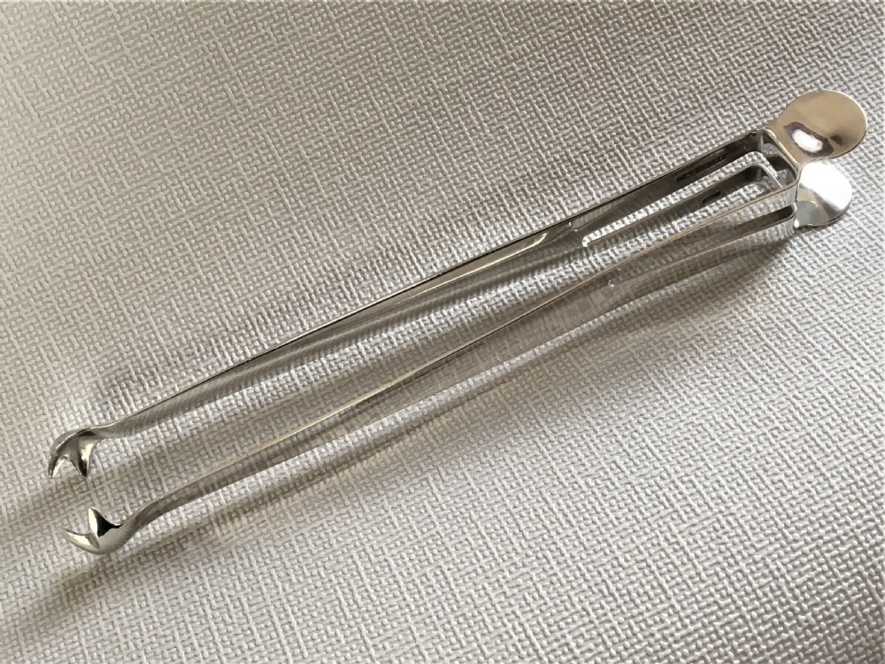 A pair of patented Edwardian silver ice tongs View V
