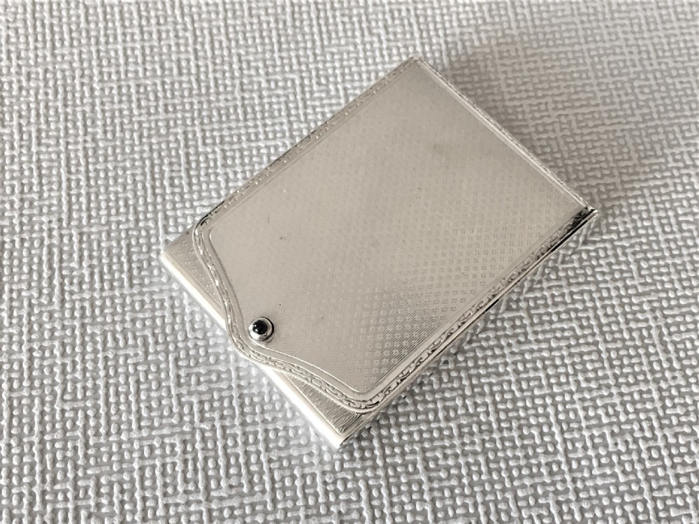 A handsome Art Deco silver match book holder