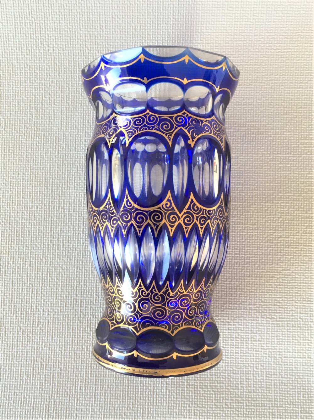 A stunning Bohemian blue glass & gilded vase