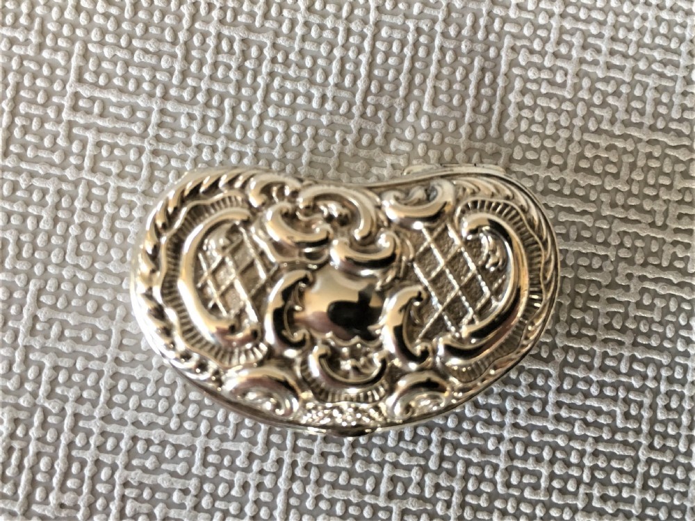 An Edwardian silver kidney shaped pillbox View III
