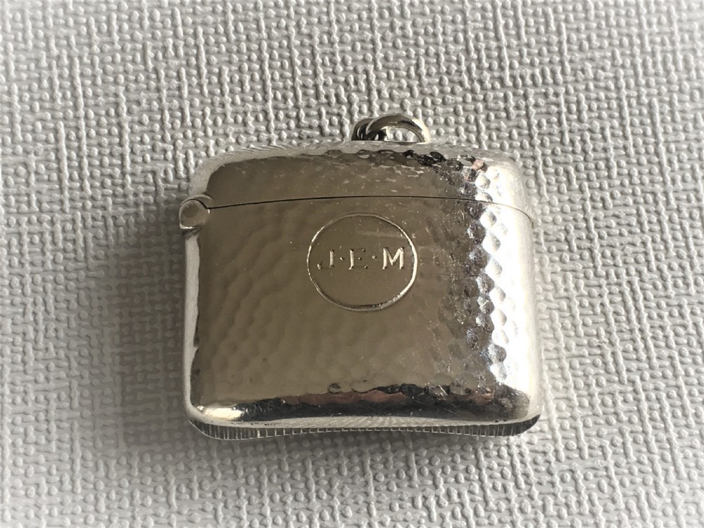 An Arts & Crafts hammered Edwardian silver vesta View III