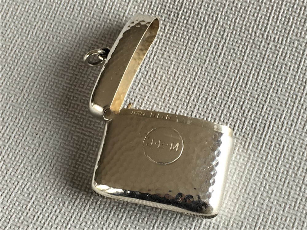 An Arts & Crafts hammered Edwardian silver vesta View VI