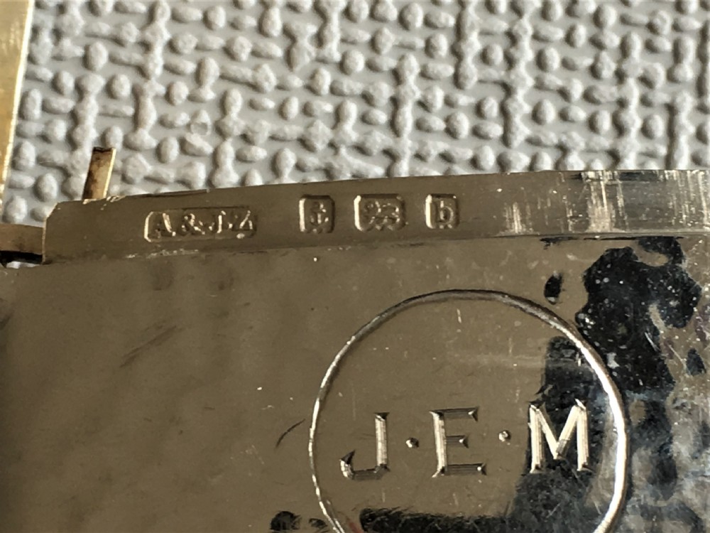 An Arts & Crafts hammered Edwardian silver vesta View VII
