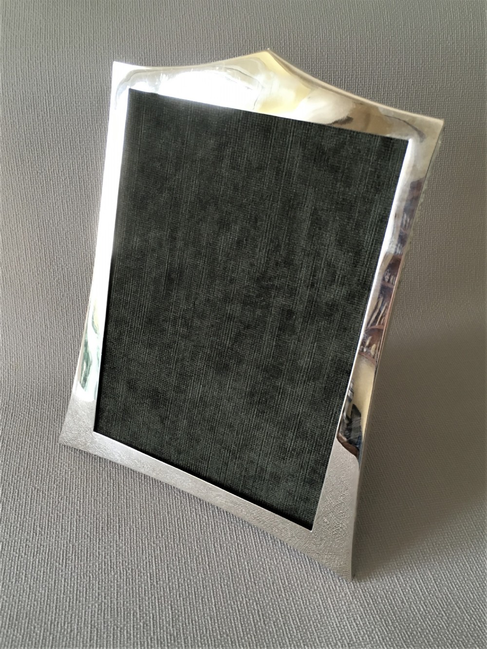 A handsome shaped silver photo frame