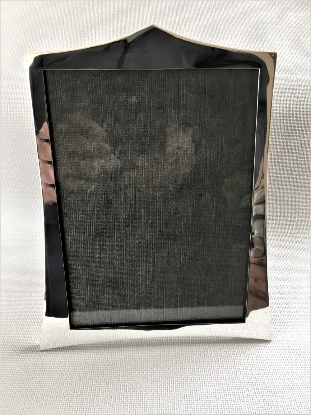 A handsome shaped silver photo frame View II