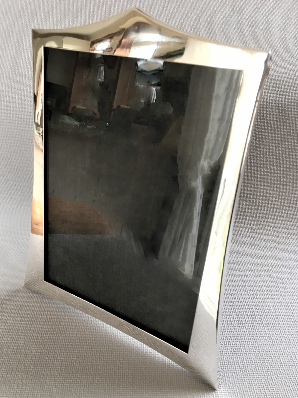 A handsome shaped silver photo frame View III