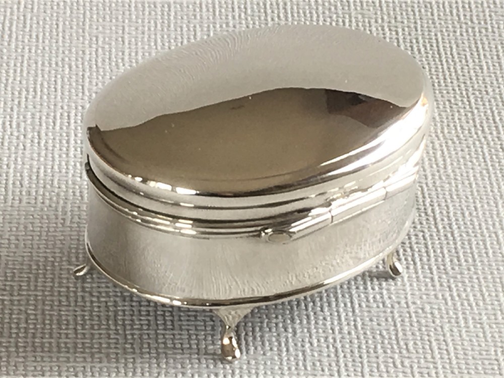 A charming oval silver trinket box