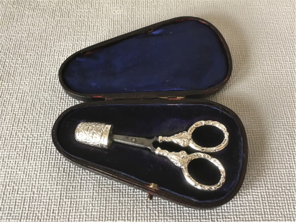 A cased pair of Victorian silver sewing scissors & thimble View III