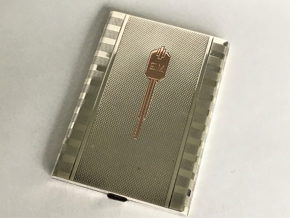  A stylish Art Deco silver & gold compact
