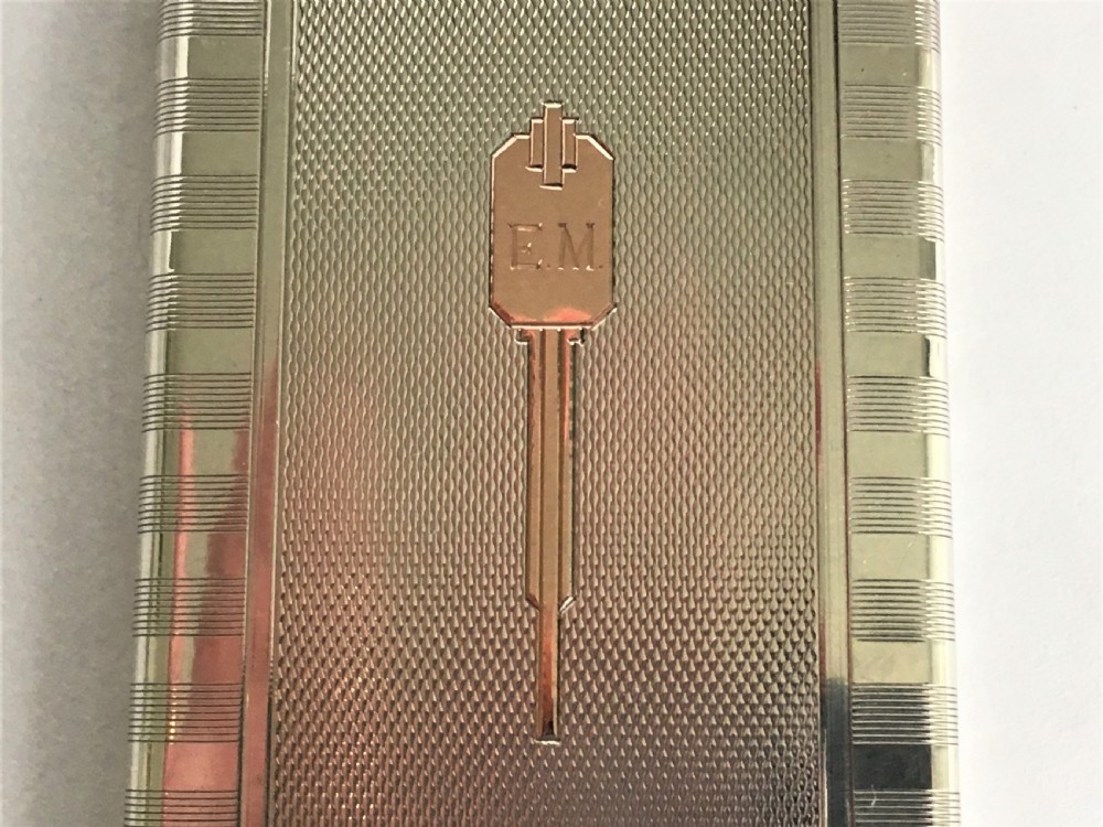  A stylish Art Deco silver & gold compact View II