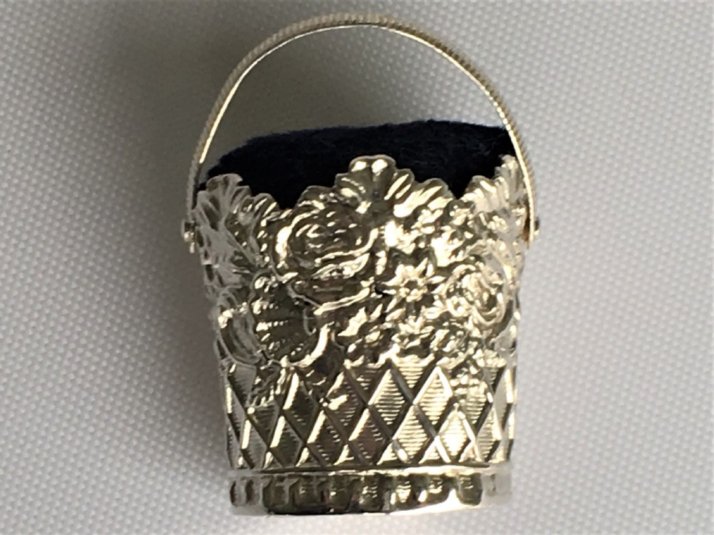 A Georgian silver basket pincushion
