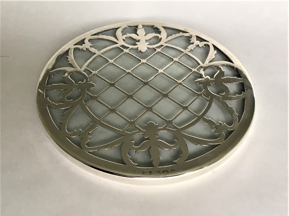 A delightful silver mounted teapot stand/coaster