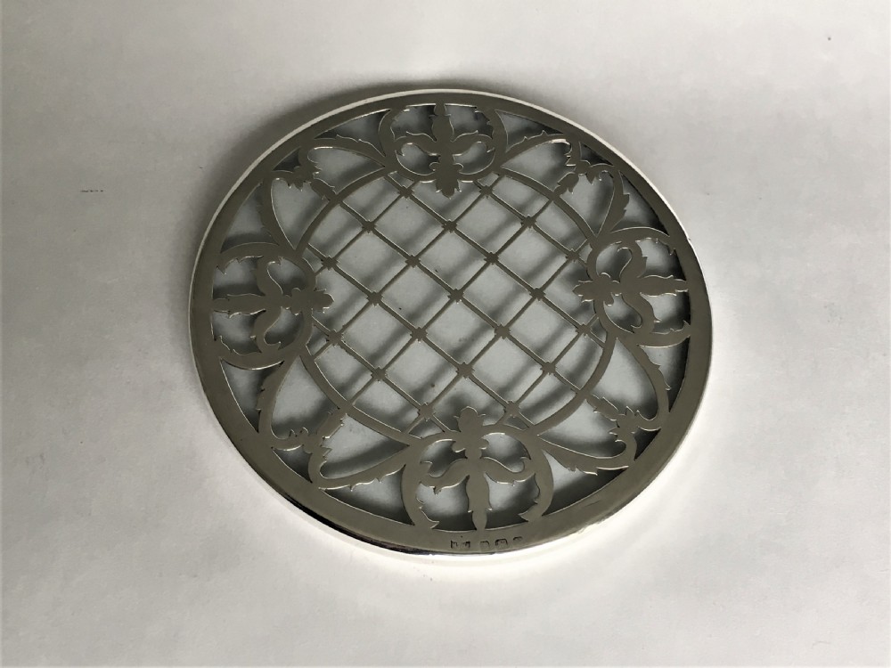 A delightful silver mounted teapot stand/coaster View II