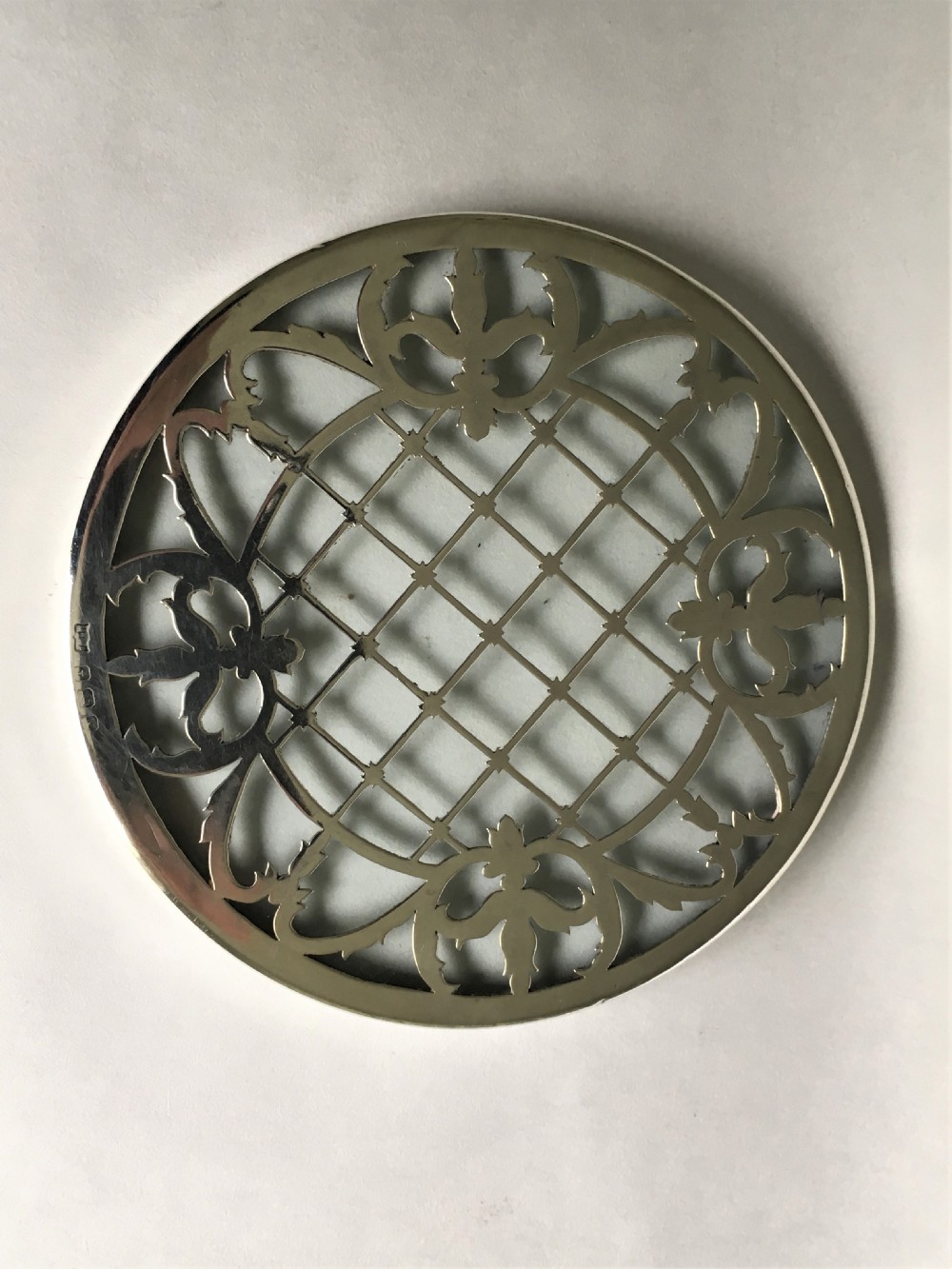 A delightful silver mounted teapot stand/coaster View III