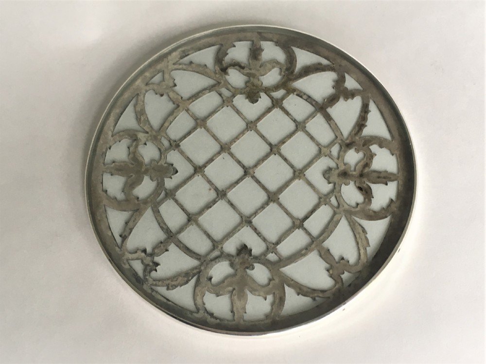 A delightful silver mounted teapot stand/coaster View IV